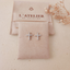 Aretes Cruz Strass Plateado - Colección Acero